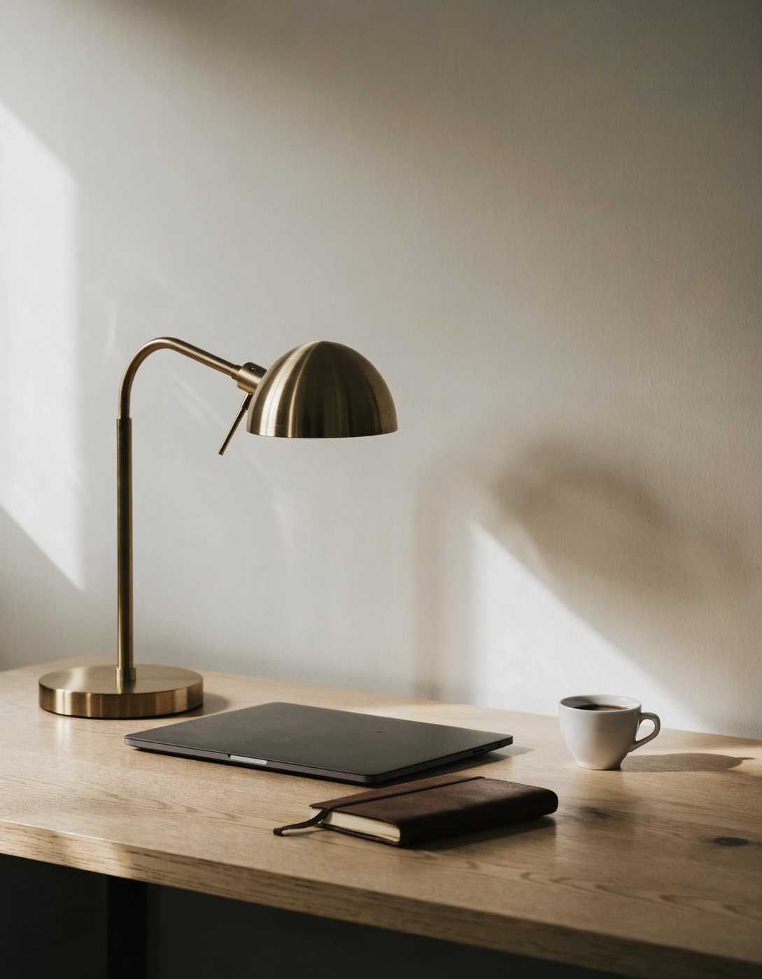 Minimal desk scene with laptop and espresso