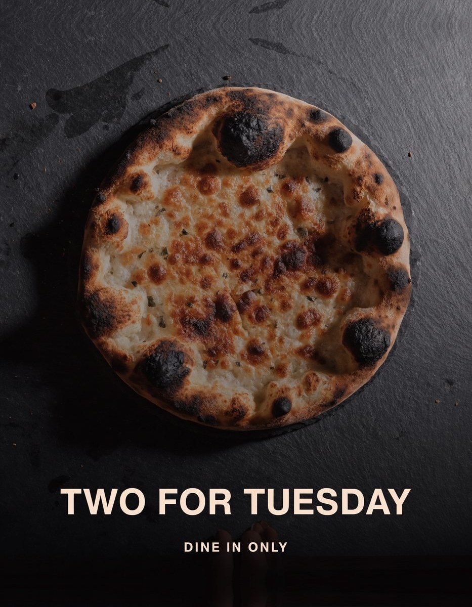 Restaurant ad reading Two For Tuesday, dine in only