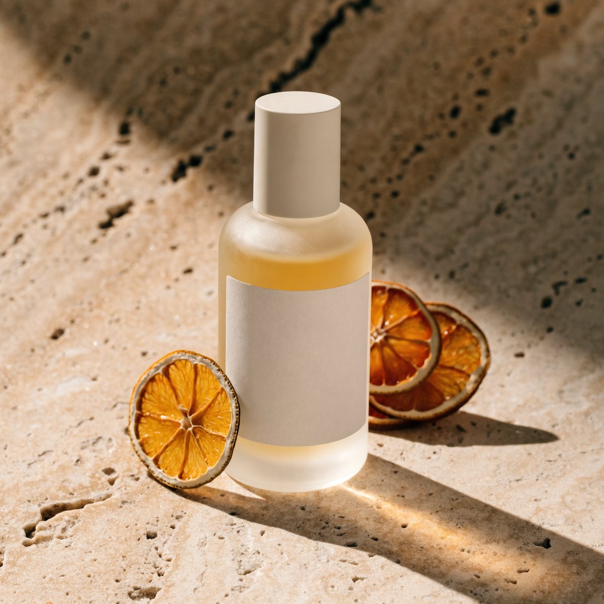 Serum bottle styled for summer with dried citrus